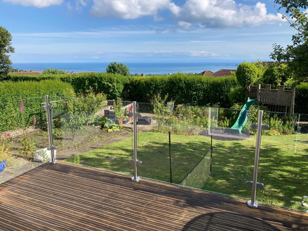 deck-glass-balustrade-garden-sea-view-swansea-swansea-glass-balustrades Glass deck balustrade with a garden and sea view in Swansea by Swansea Glass Balustrades
