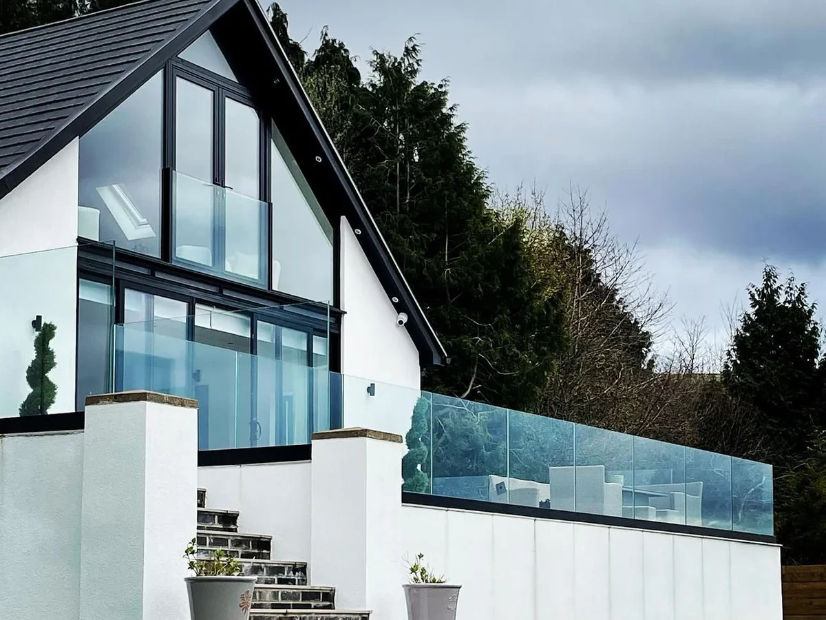 Frameless glass balustrade on a modern house terrace in Swansea by Swansea Glass Balustrades