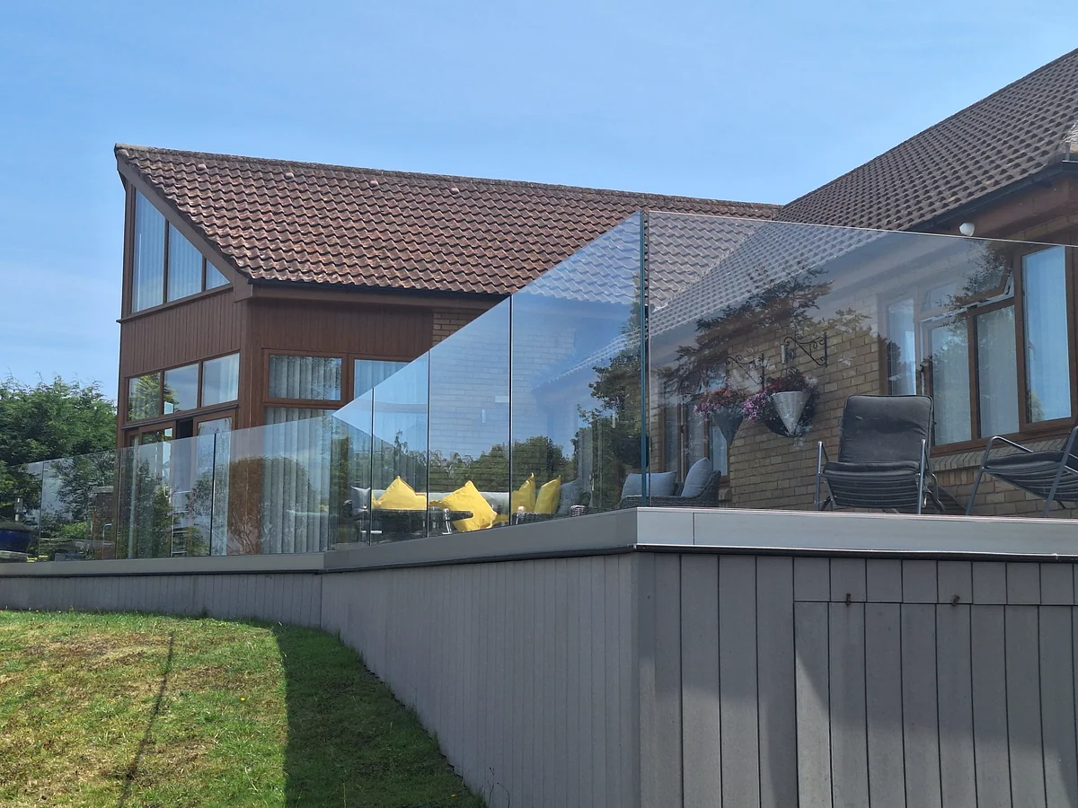 frameless-glass-balustrade-raised-deck-corner-swansea-swansea-glass-balustrades Frameless glass balustrade on a raised deck corner in Swansea by Swansea Glass Balustrades