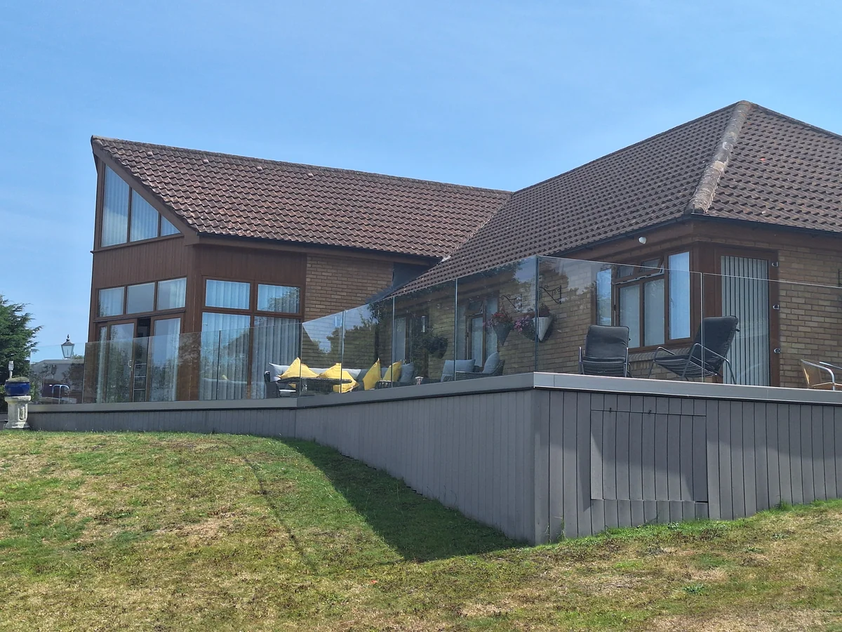 frameless-glass-balustrade-raised-deck-frontage-swansea-swansea-glass-balustrades Frameless glass balustrade along a raised deck frontage in Swansea by Swansea Glass Balustrades