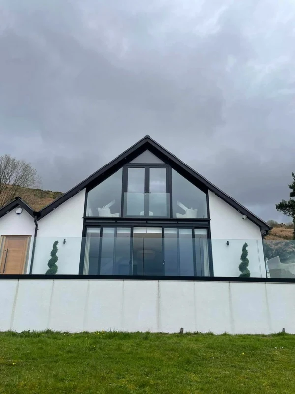 glass-balcony-juliet-balconies-white-apex-house-swansea-swansea-glass-balustrades Glass balcony balustrade showing juliet balconies white apex house in Swansea by Swansea Glass Balustrades