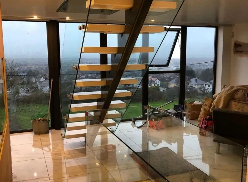 glass-balustrade-staircase-floating-staircase-picture-window-swansea-swansea-glass-balustrades-wide Floating staircase with a glass balustrade beside a picture window in Swansea by Swansea Glass Balustrades