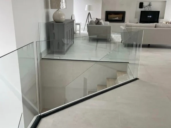 glass-balustrade-staircase-frameless-mezzanine-over-kitchen-swansea-swansea-glass-balustrades-wide Frameless glass balustrade around a mezzanine landing above a kitchen in Swansea by Swansea Glass Balustrades