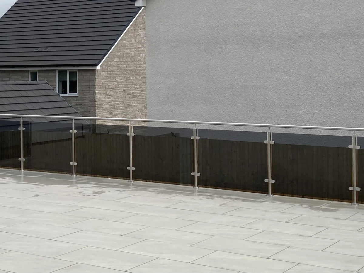 outdoor-glass-balustrade-large-tiled-patio-swansea-swansea-glass-balustrades Glass balustrade around a large tiled patio in Swansea by Swansea Glass Balustrades