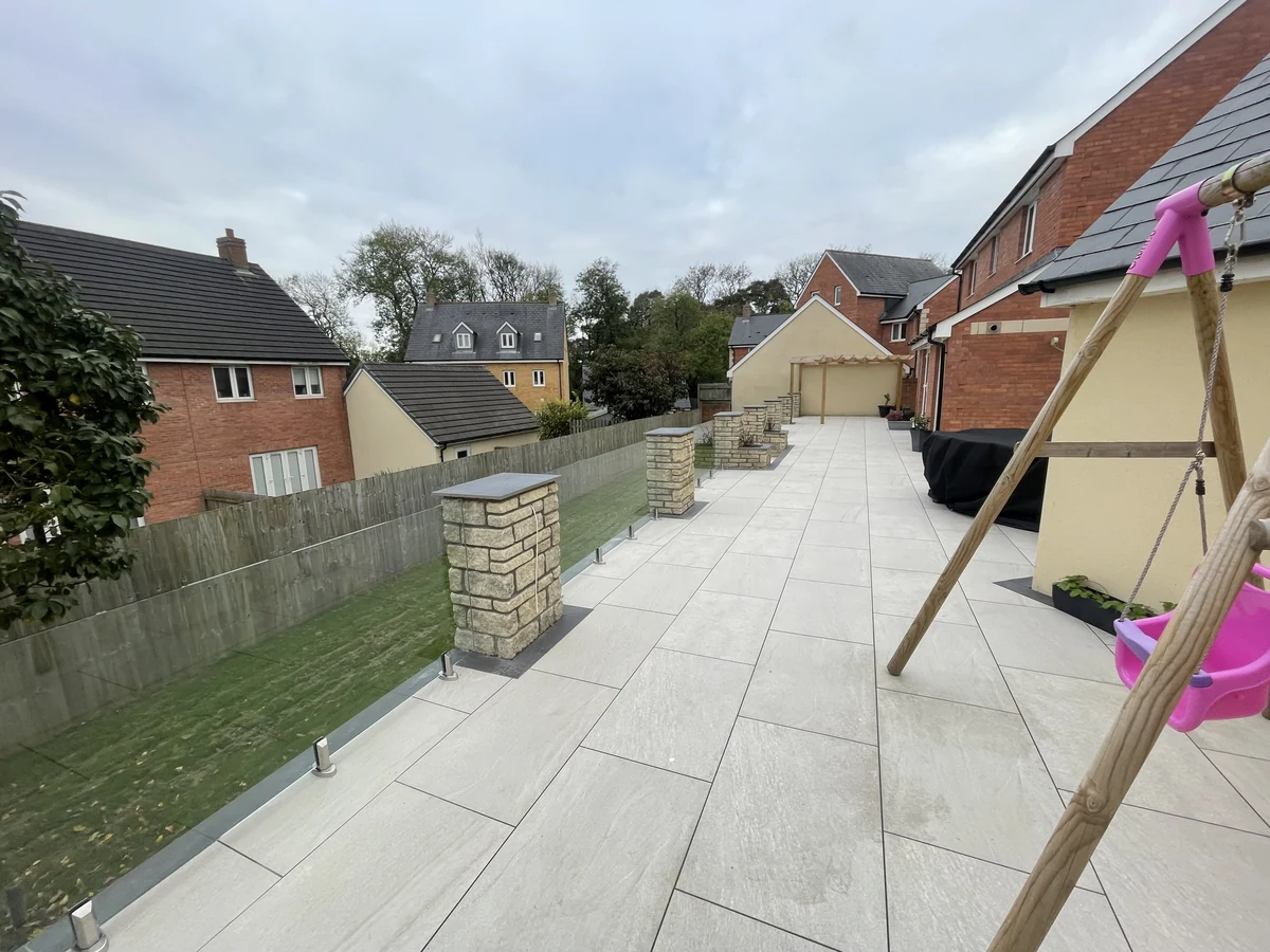 Glass balustrade along a long patio boundary in Swansea by Swansea Glass Balustrades